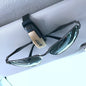 TYPER. Clip-soporte de automóvil para gafas de sol.